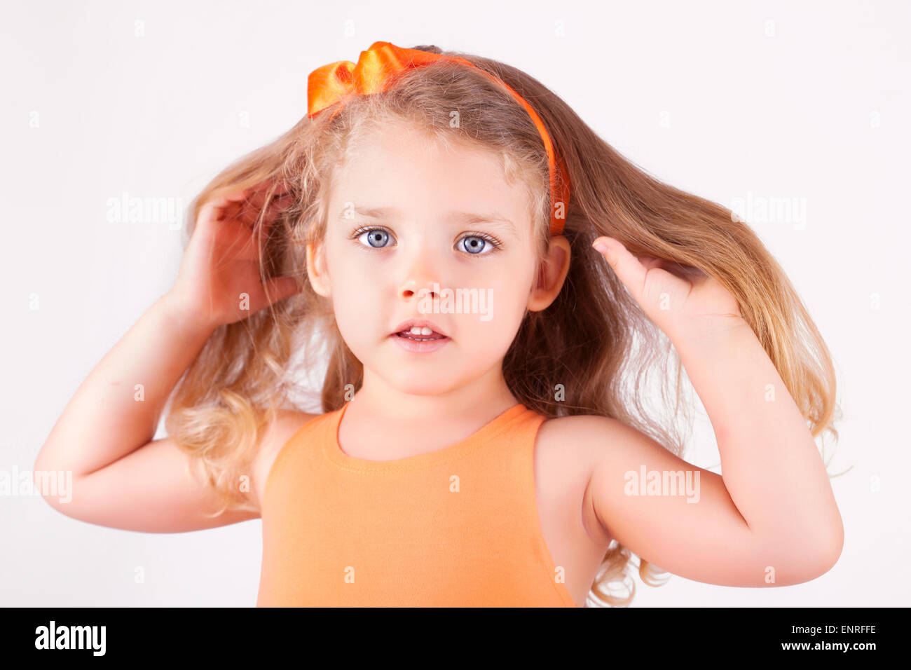 Portrait of a little girl on white background Stock Photo - Alamy