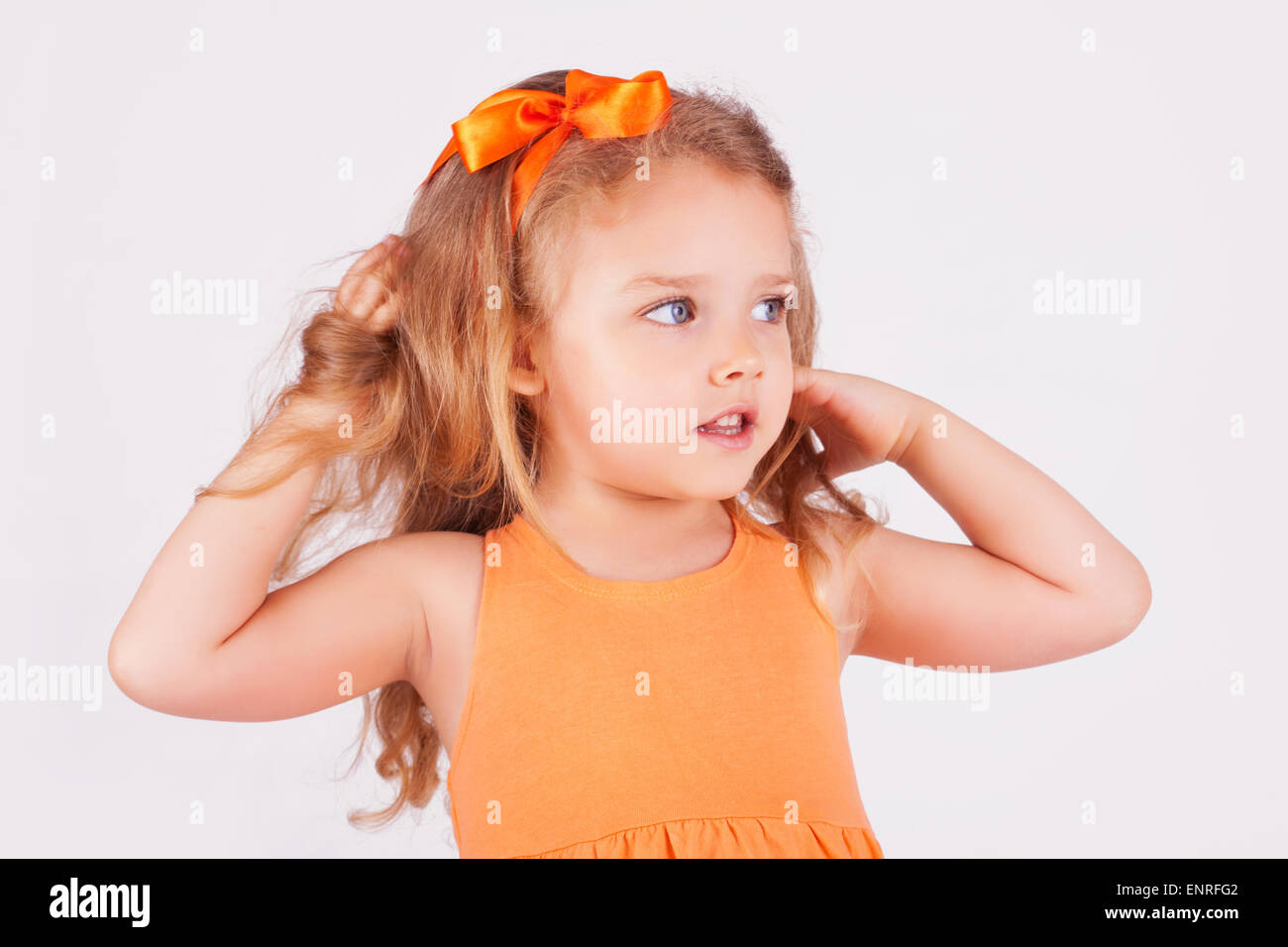 Portrait of a little girl on white background Stock Photo - Alamy