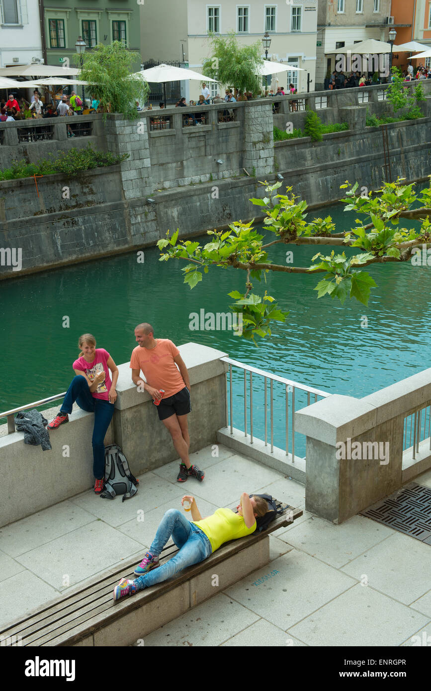 some people on the river bank in Ljubljana Stock Photo