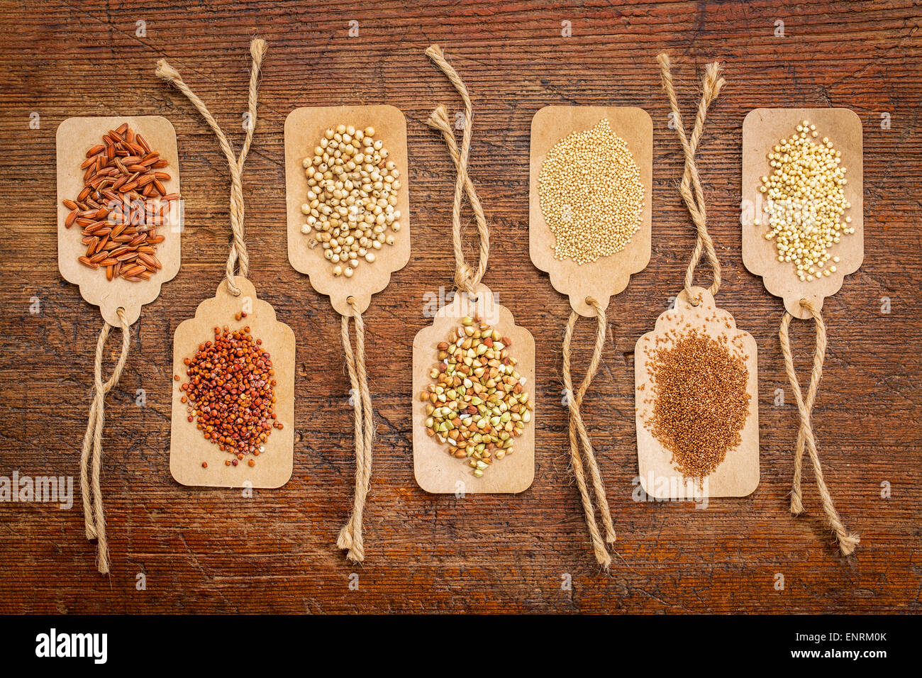 abstract of healthy, gluten free grains (quinoa, sorghum, brown rice, teff, buckwheat, amaranth, millet) - top view of paper pri Stock Photo