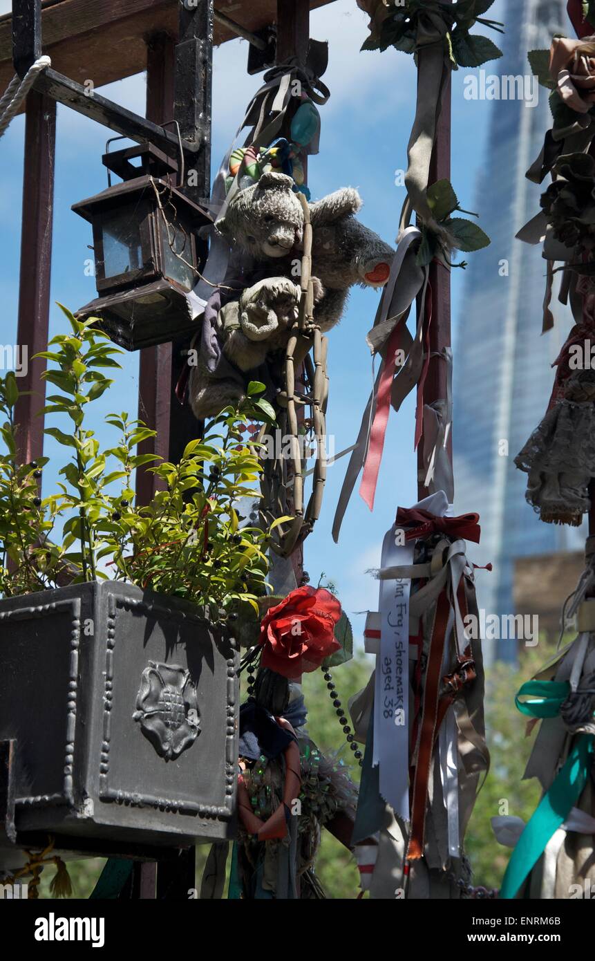 Flowers and Ribbons left on the gate of The Cross Bones Graveyard, Southwark, London, England, UK Stock Photo