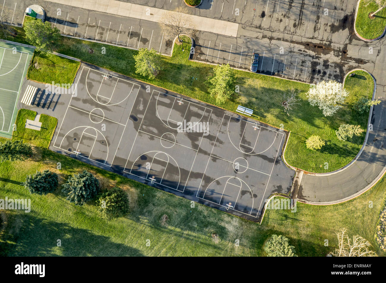 aerial view of a public park with recreational basketball courts and