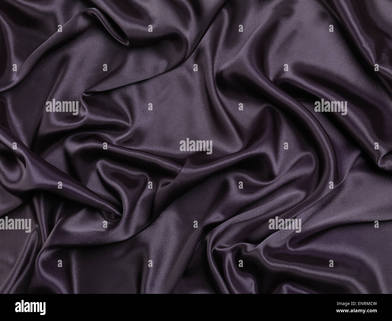 Black shiny silky fabric abstract background texture Stock Photo