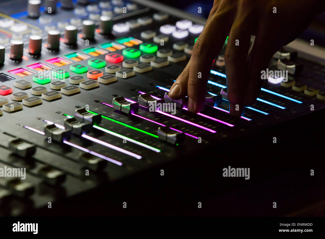 Audio mixer mixing board fader and knobs, Music mixing console with backlit  buttons Stock Photo - Alamy