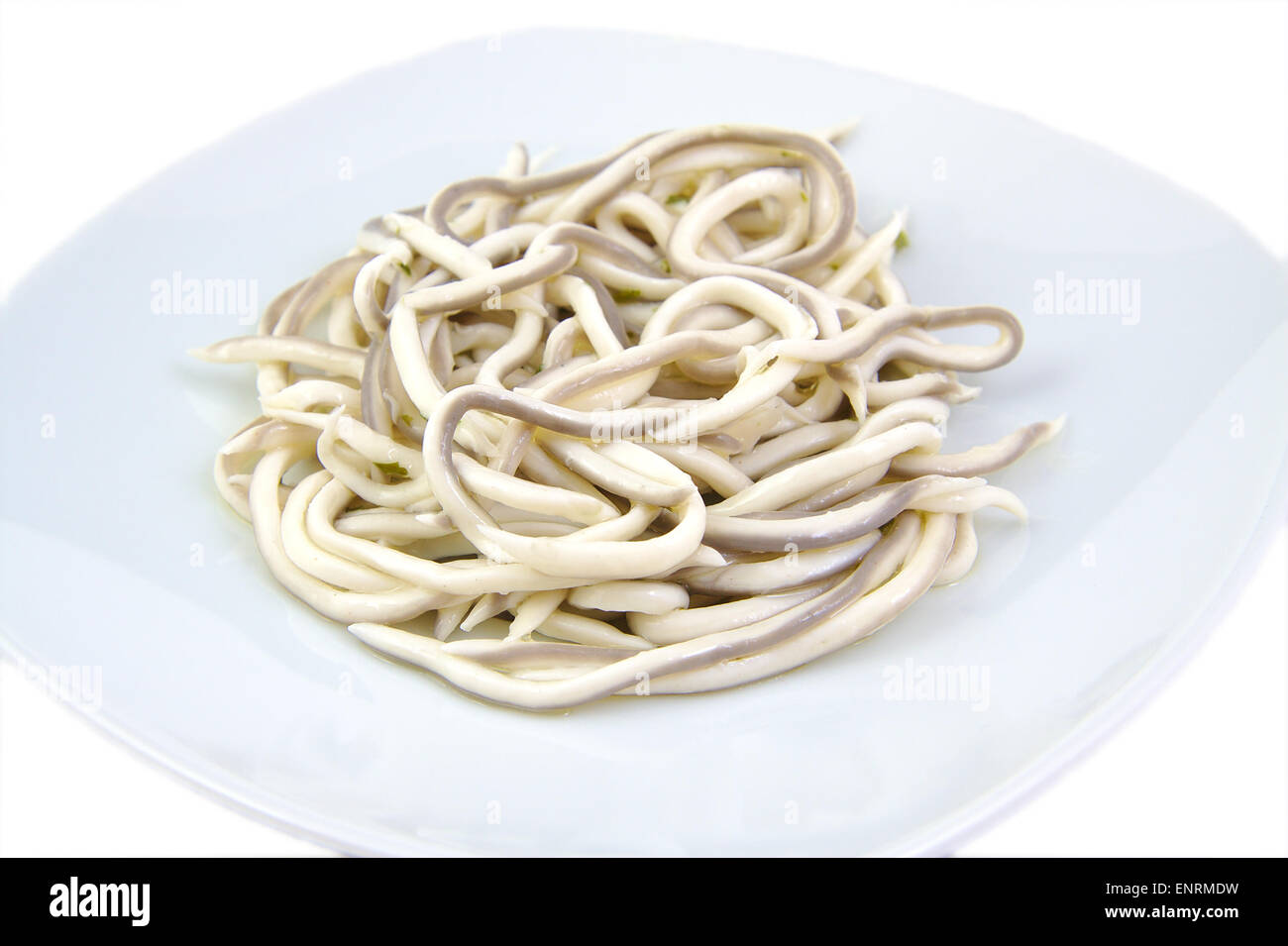 Baby eels, gulas or elver substitute in garlic sauce. Traditional