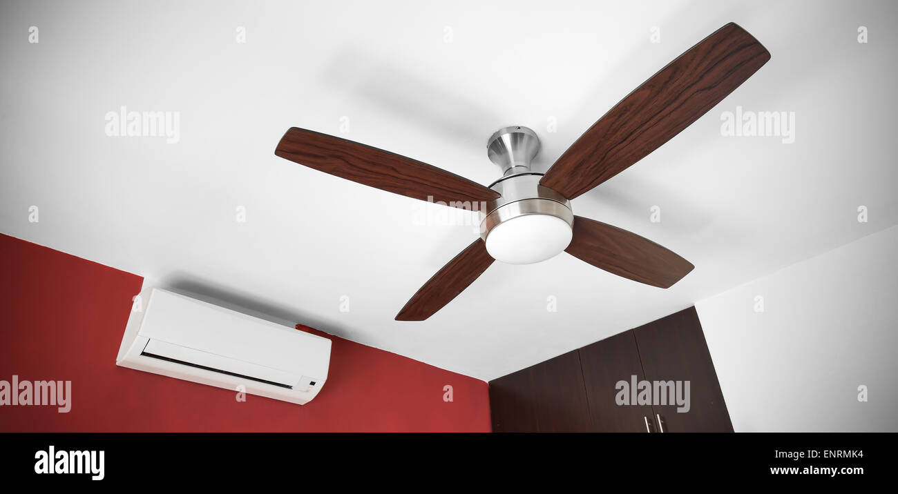 Electric Ceiling Fan And Split System Air Conditioner At The Room