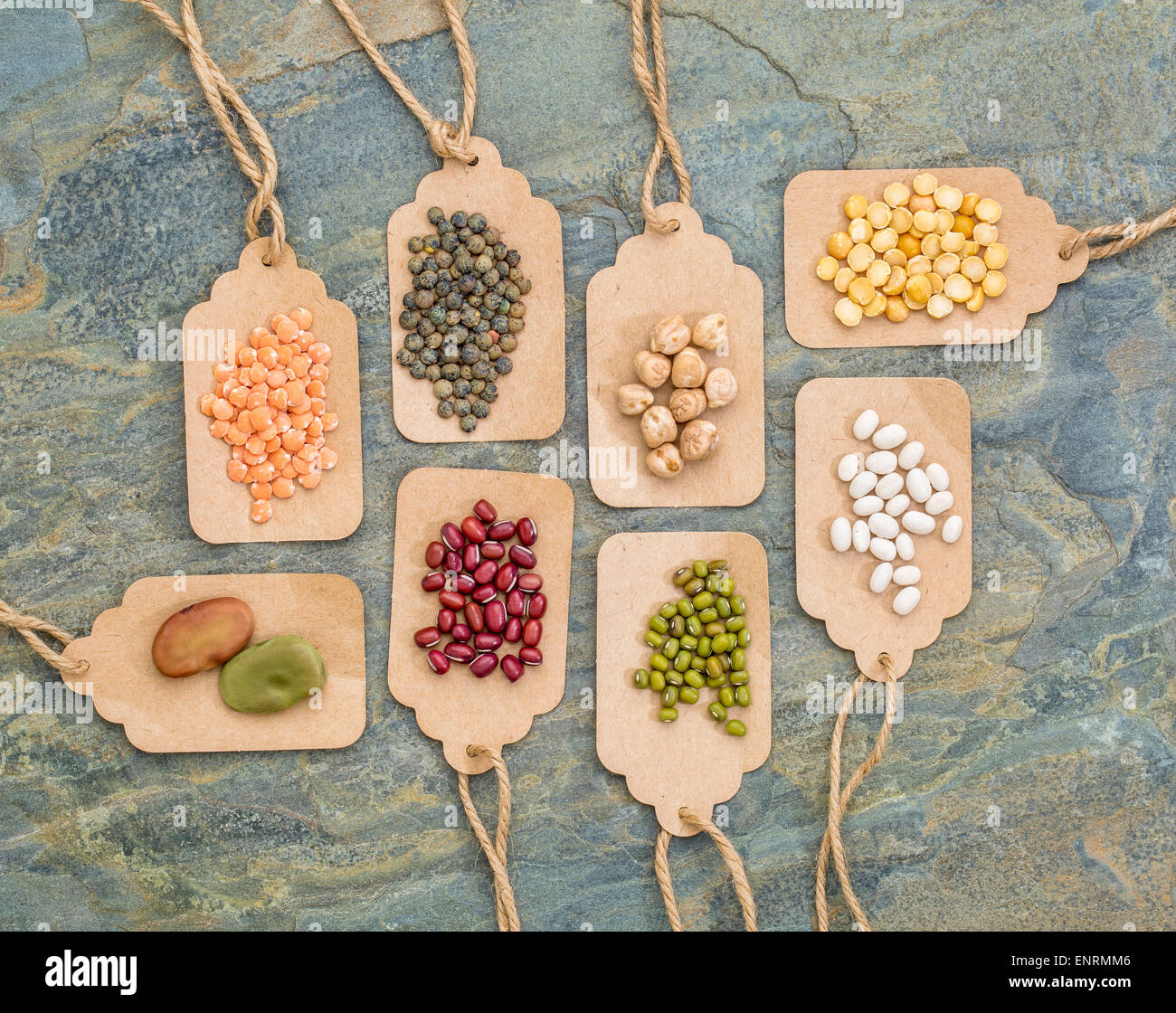 legume abstract (fava bean, red lentils, adzuki bean, soy, mung bean,navy bean, yellow pea, French lentils) - top view of paper  Stock Photo