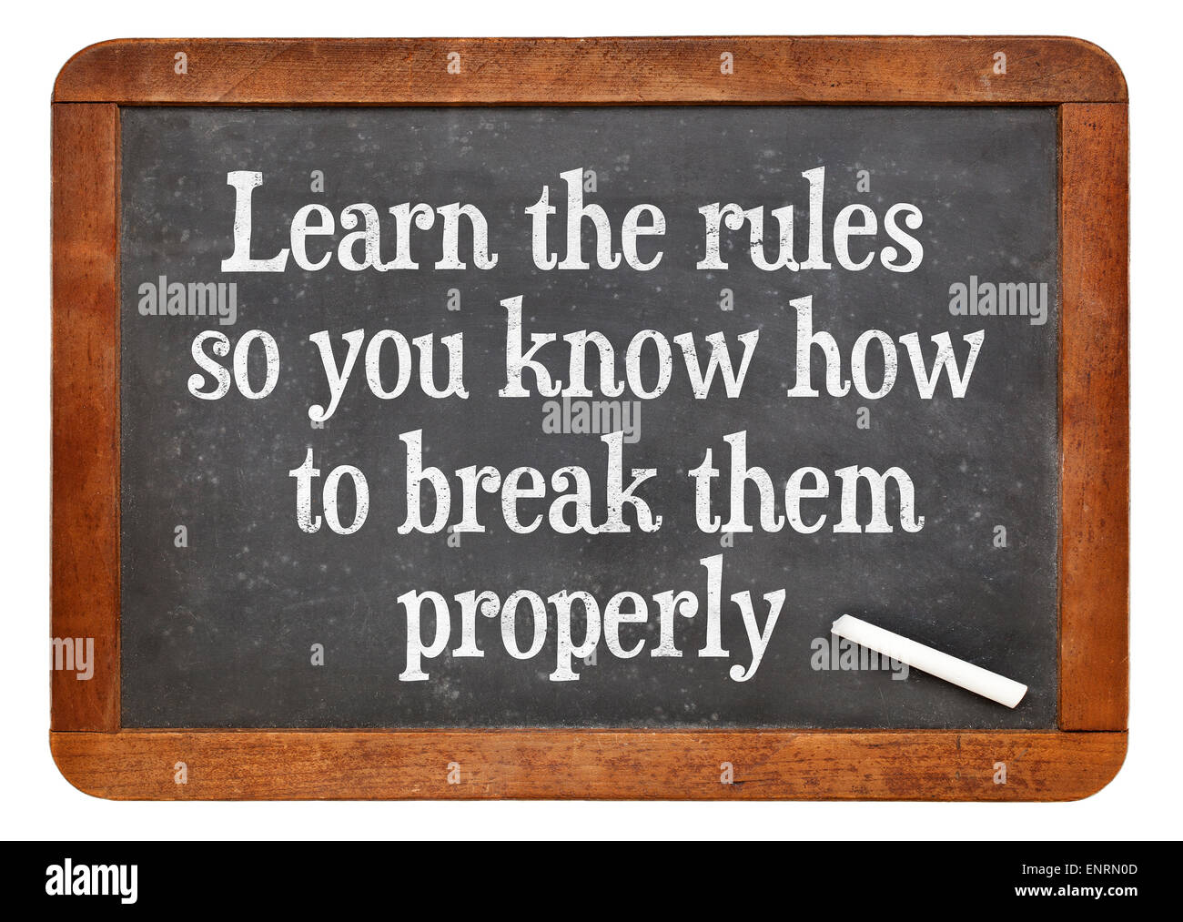 Learn the rules, so you know hot to break them properly. INspirational words on a vintage slate blackboard Stock Photo