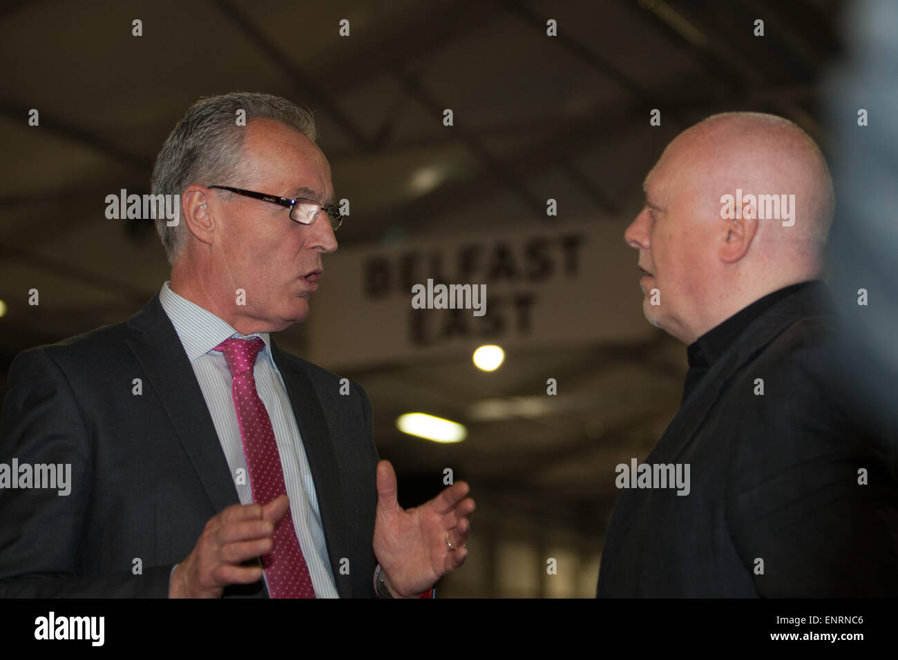 Belfast UK. 7th May 2015 General Election:  Gerry Kelly (Sinn Fein)  talking to Danny Morrison during the Result count Stock Photo