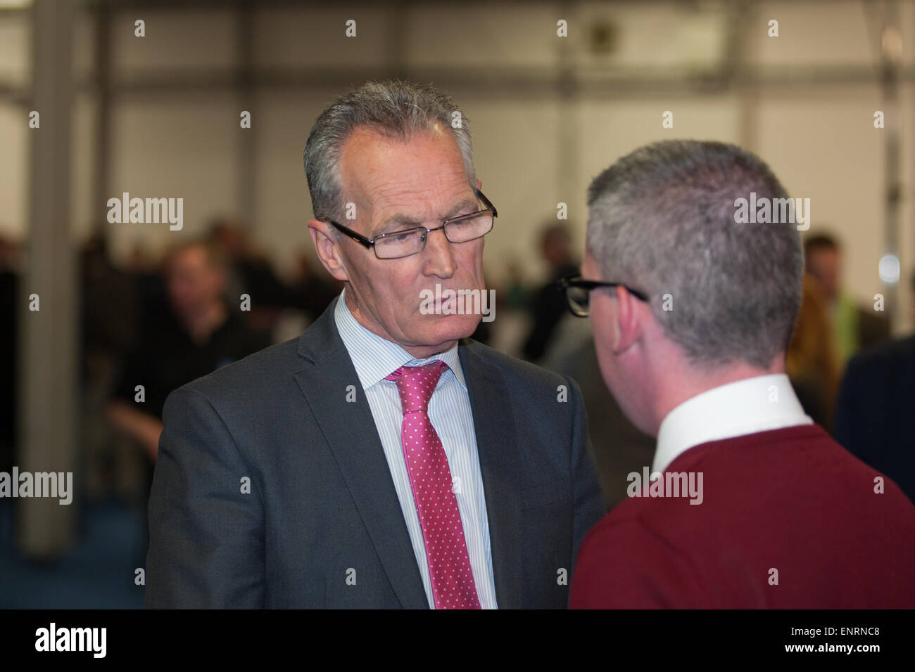 Belfast UK. 7th May 2015 General Election:  Gerry Kelly (Sinn Fein)  talking to Niall Ó Donnghaile during the Result count of Be Stock Photo