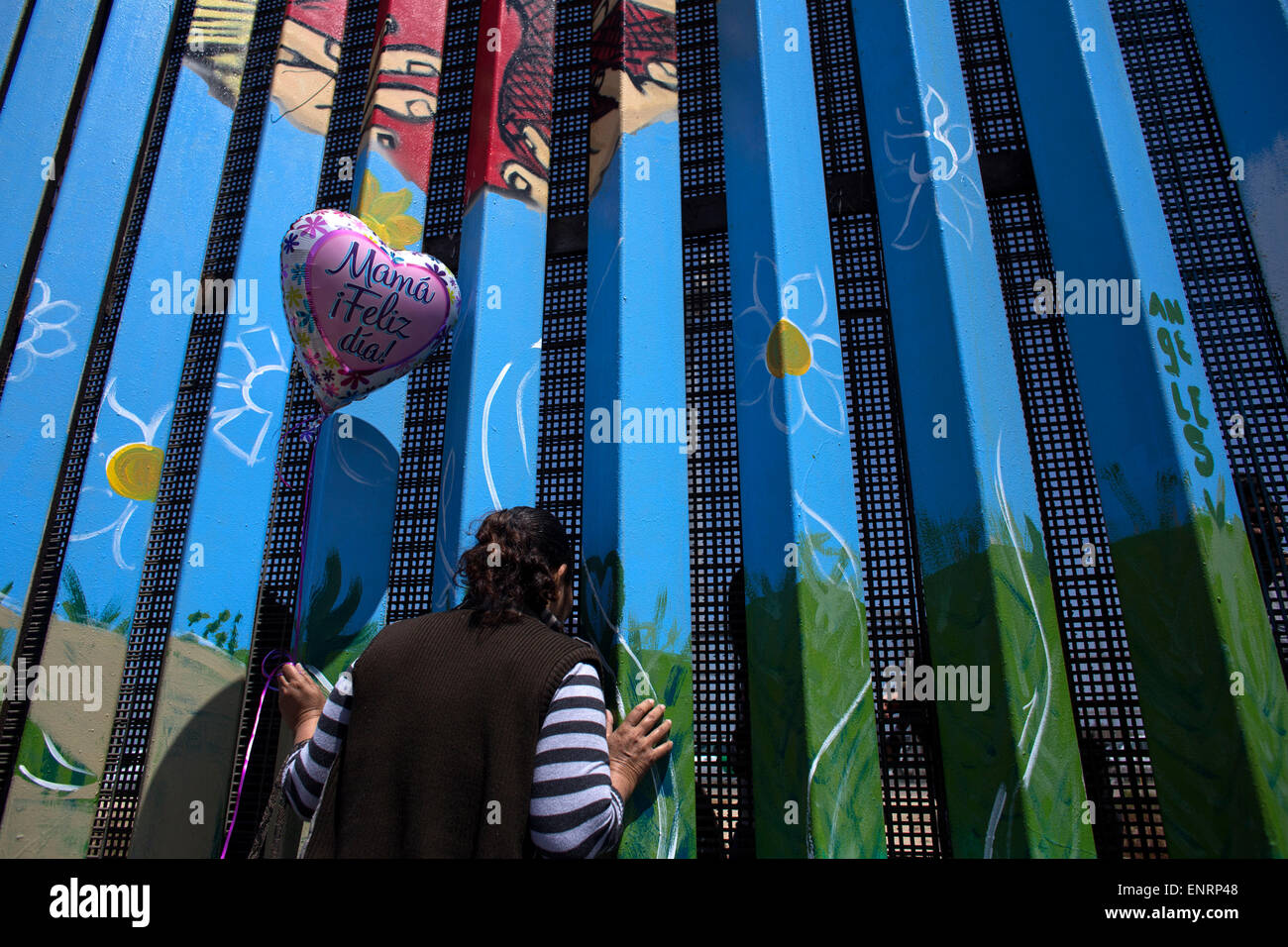 Tijuana, Mexico. 10th May, 2015. Irma Estela Garcia talks with her daughter Estela Cabrera through the border fence, during a celebration in the context of Mother's Day organized by Border Angels and Dreamers Moms, in the Friendship Park located in the border between Mexico and the U.S., in Tijuana city, northwest of Mexico, on May 10, 2015. Credit:  Guillermo Arias/Xinhua/Alamy Live News Stock Photo