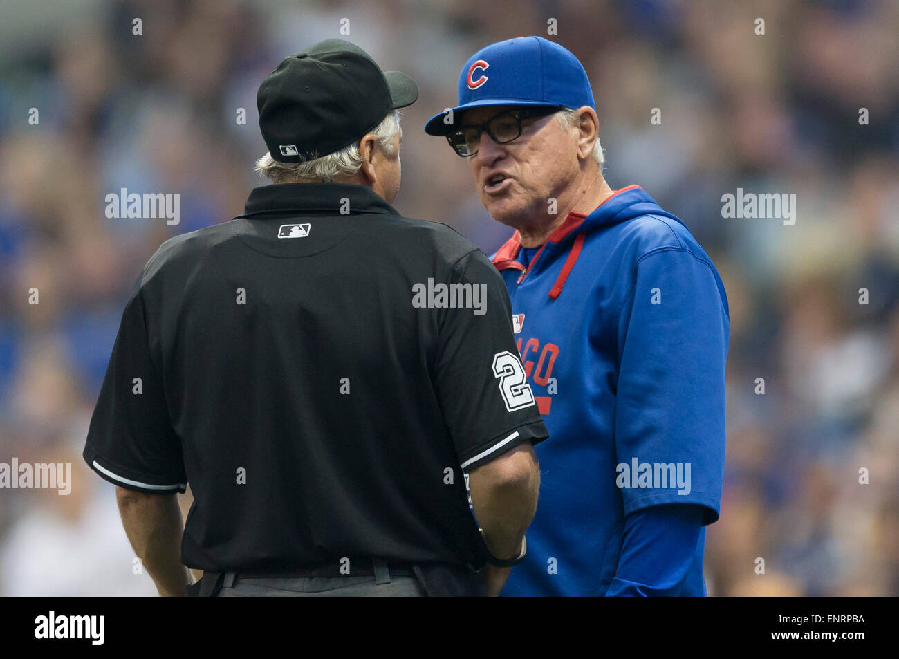 Milwaukee, WI, USA. 9th May, 2015. Chicago Cubs manager Joe Maddon #70 talks with home plate umpire Tom Hallion about a trapped ball under the center field fence during the Major League Baseball game between the Milwaukee Brewers and the Chicago Cubs at Miller Park in Milwaukee, WI. John Fisher/CSM/Alamy Live News Stock Photo