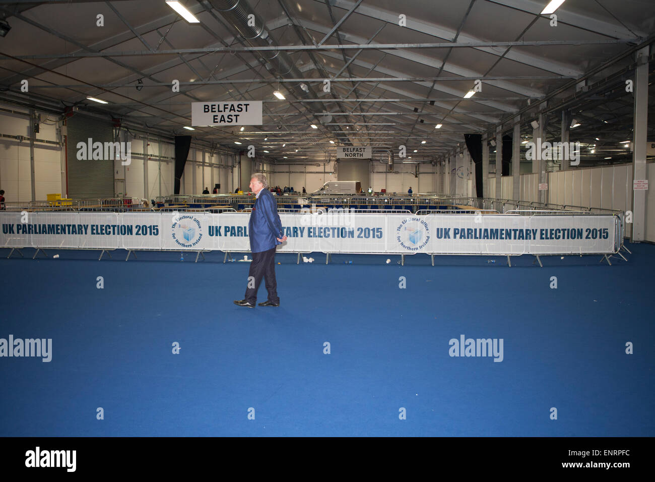 Belfast UK. 7th May 2015 General Election: A lone man walks through an emptying Kings Hall in Belfast Stock Photo