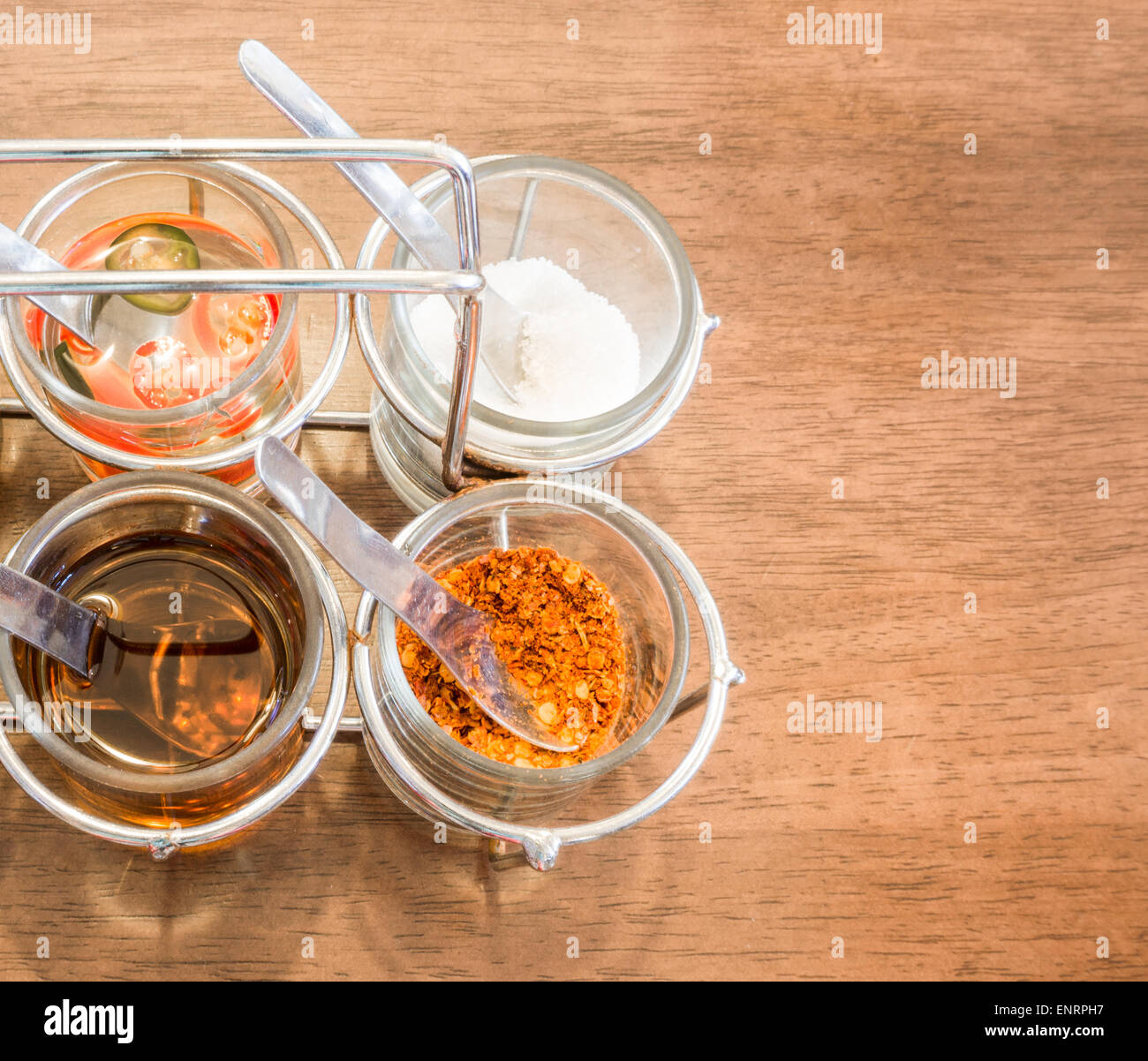 Thai Condiment for Noodle with Four Glasses of Ingredient Stock Photo