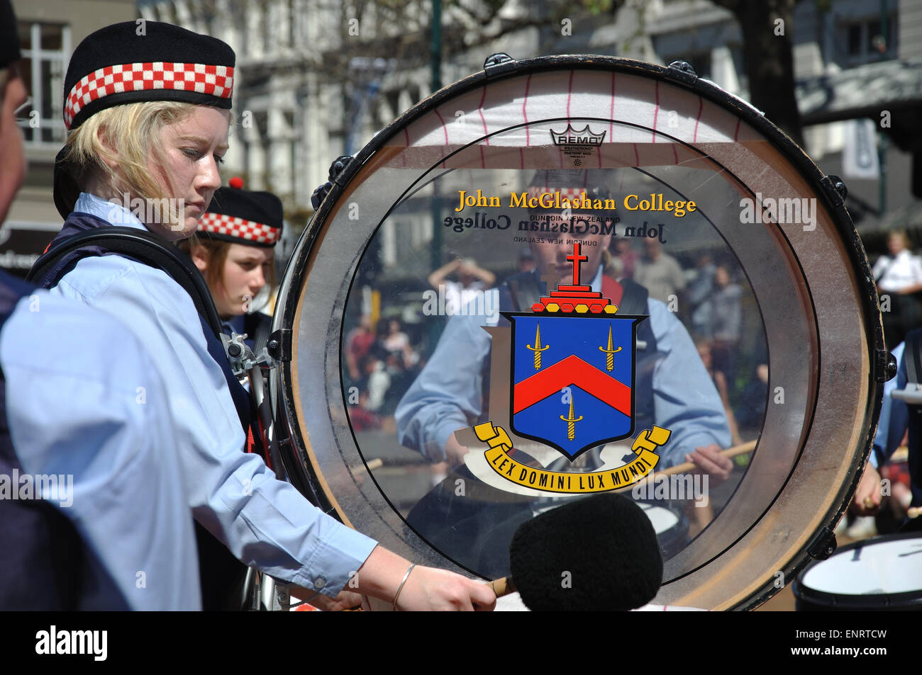 DUNEDIN, NEW ZEALAND, FEBRUARY 21, 2010: An unidentified schoolgirl beats her drum in a pipe band competition in the Octagon Stock Photo