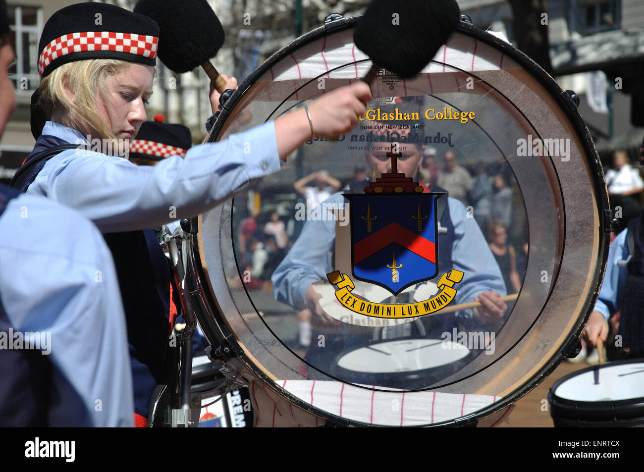 DUNEDIN, NEW ZEALAND, FEBRUARY 21, 2010: An unidentified schoolgirl beats her drum in a pipe band competition in the Octagon Stock Photo