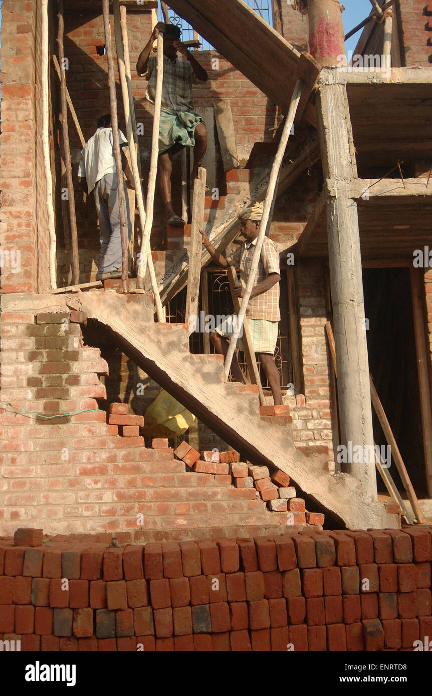 TAMIL NADU, INDIA, circa 2009: Unidentified carpenters working on a construction site, circa 2009 in Tamil Nadu, India. Stock Photo