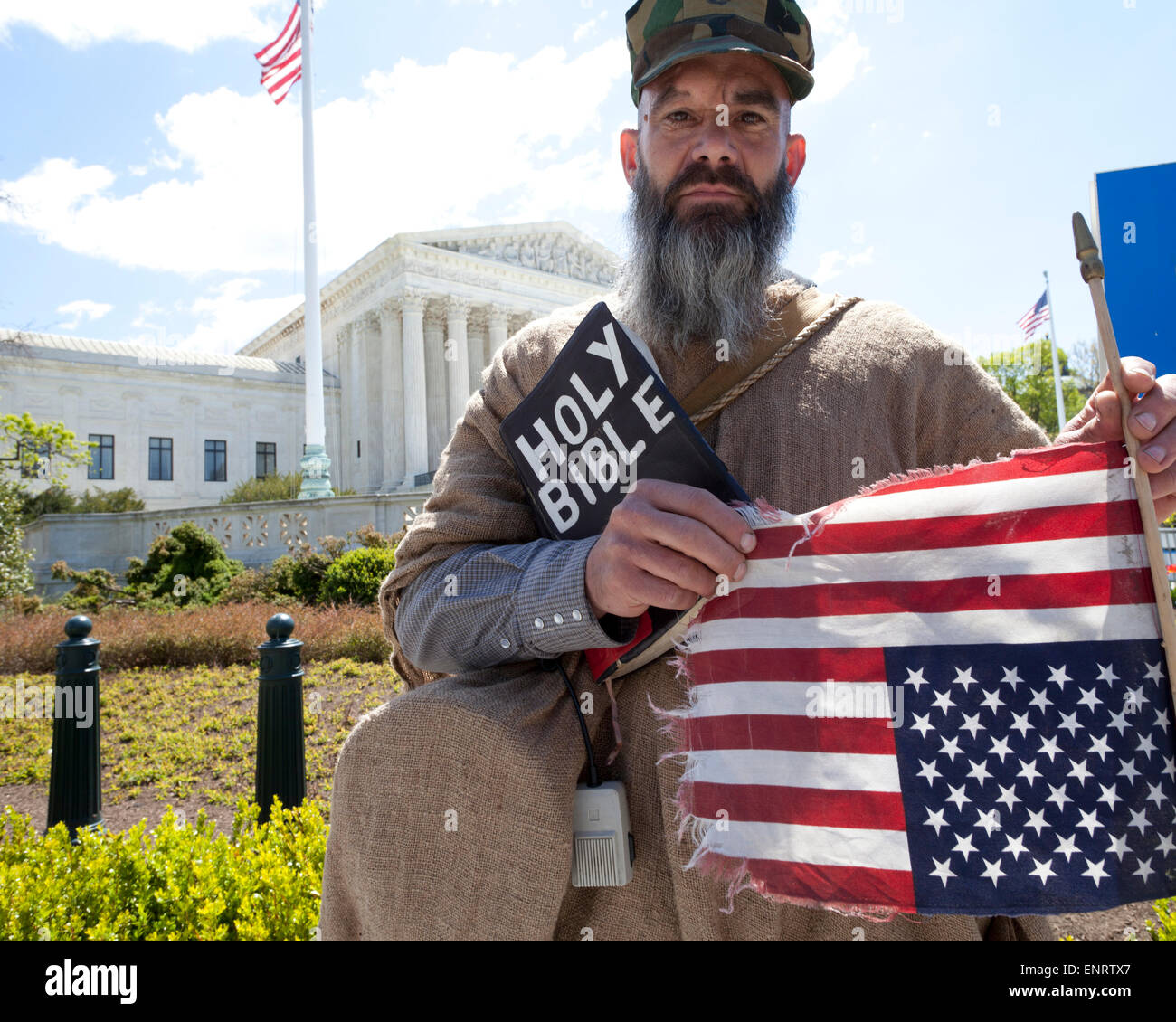 Alan Hoyle carrying a Holy Bible and upside down American Flag in front of The US Supreme Court building - Washington, DC USA Stock Photo