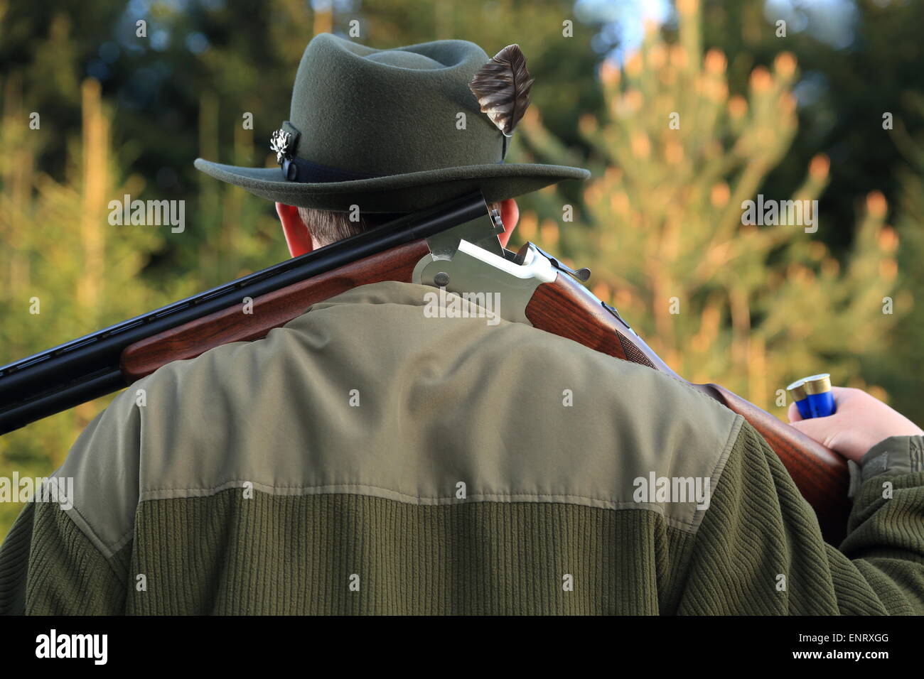 A Hunter shouldering his shot gun Stock Photo