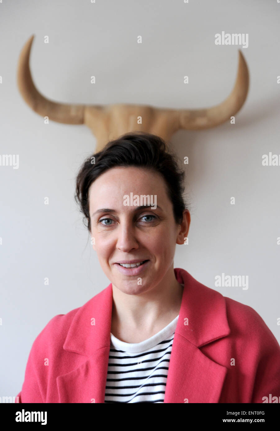 Young woman looking up wacky quirky portrait with horns growing out of her head Stock Photo Alamy