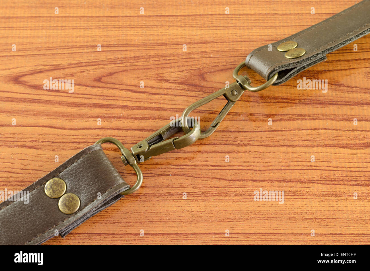 bag leather strap on wood background Stock Photo - Alamy