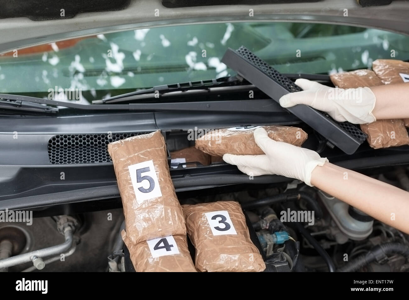 drug smuggled in a car engine compartment. Drug stash spot