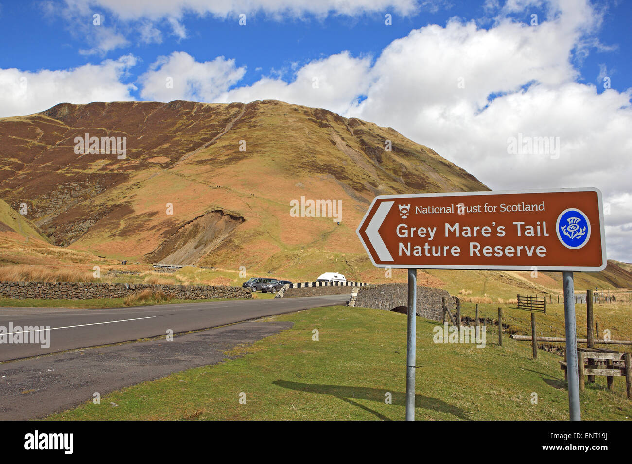Sign and route to the Grey Mare's Tail Waterfall and Nature Reserve near Moffat in Southern Scotland. Stock Photo