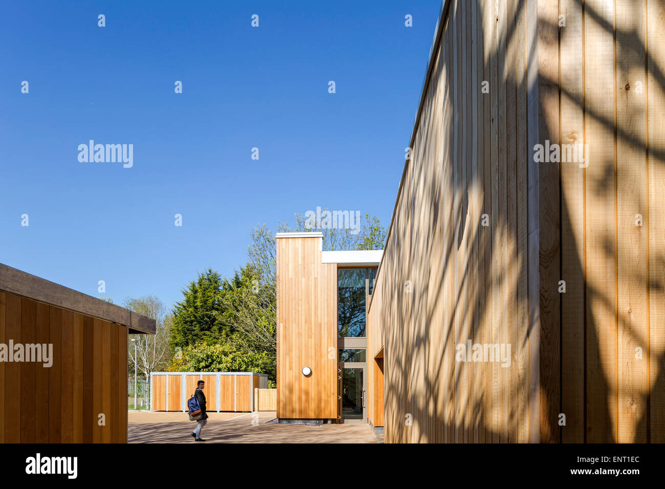 Detail of cladding and bike store with person. The Office in the Park, Greenford, United Kingdom. Architect: Dannatt, Johnson Ar Stock Photo