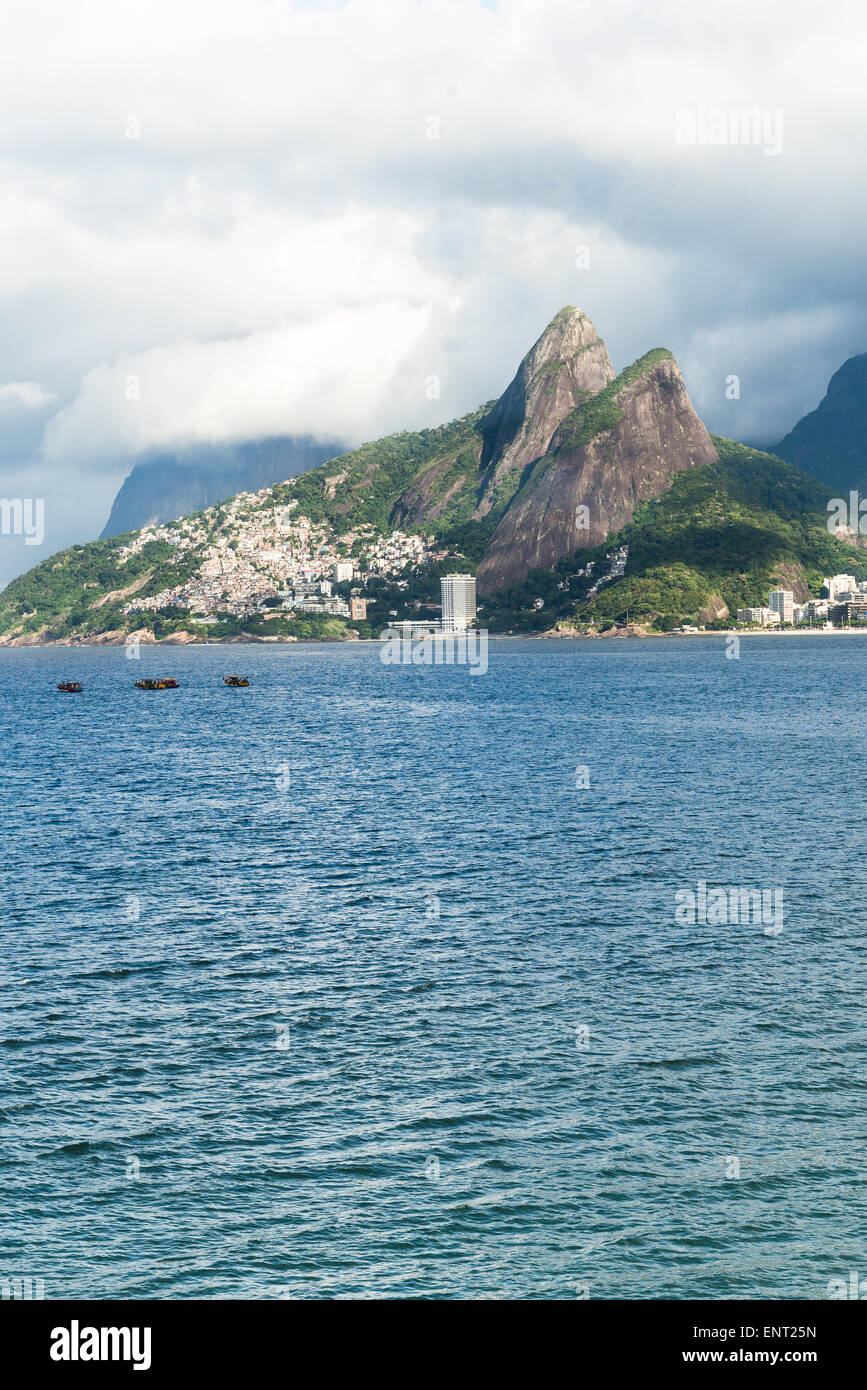 View of mountain Dois Irmãos, Two Brothers, and Vidigal favela slum from Ipanema, Rio de Janeiro, Brazil Stock Photo