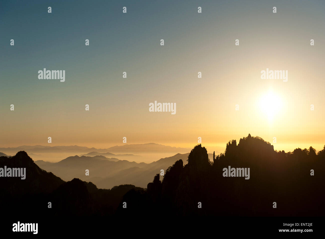 Morning atmosphere, sunrise, rocks and mountains, silhouette, Huang Shan, Mount Huangshan, Anhui Province Stock Photo