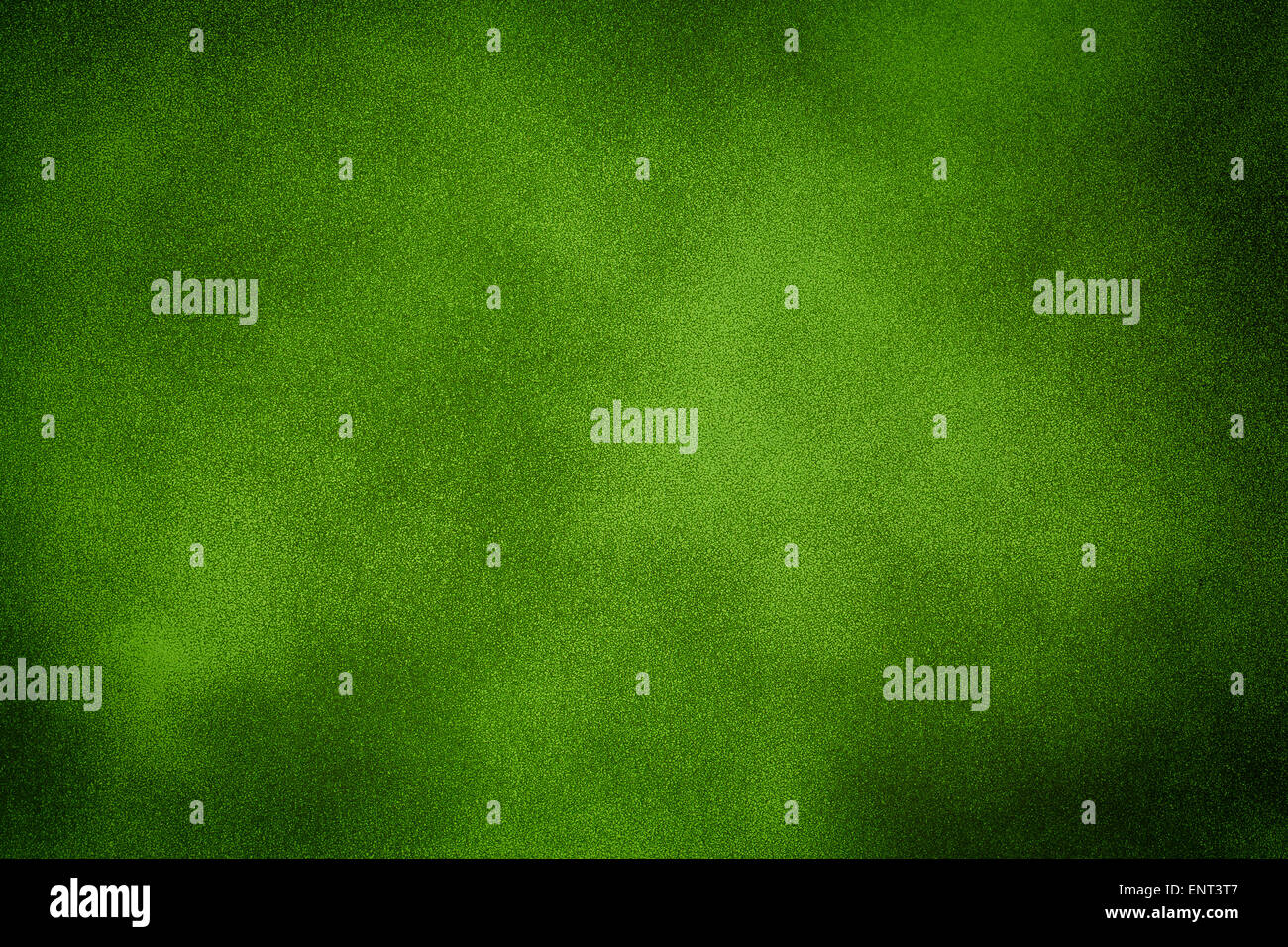 Green grunge wall background with dark spots Stock Photo