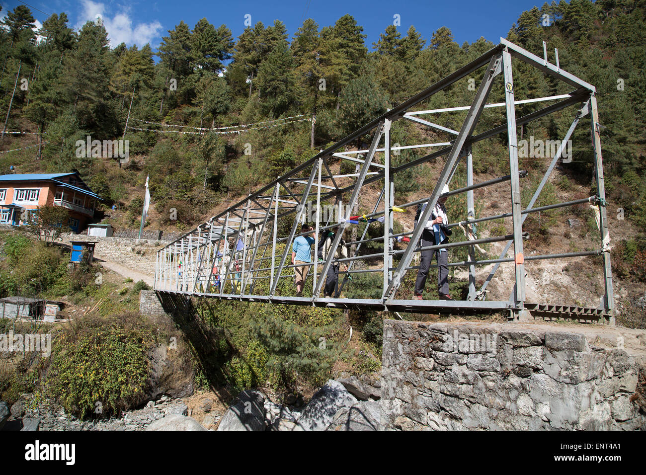 Walking Across a Bridge, Everest Trail, Nepal Stock Photo