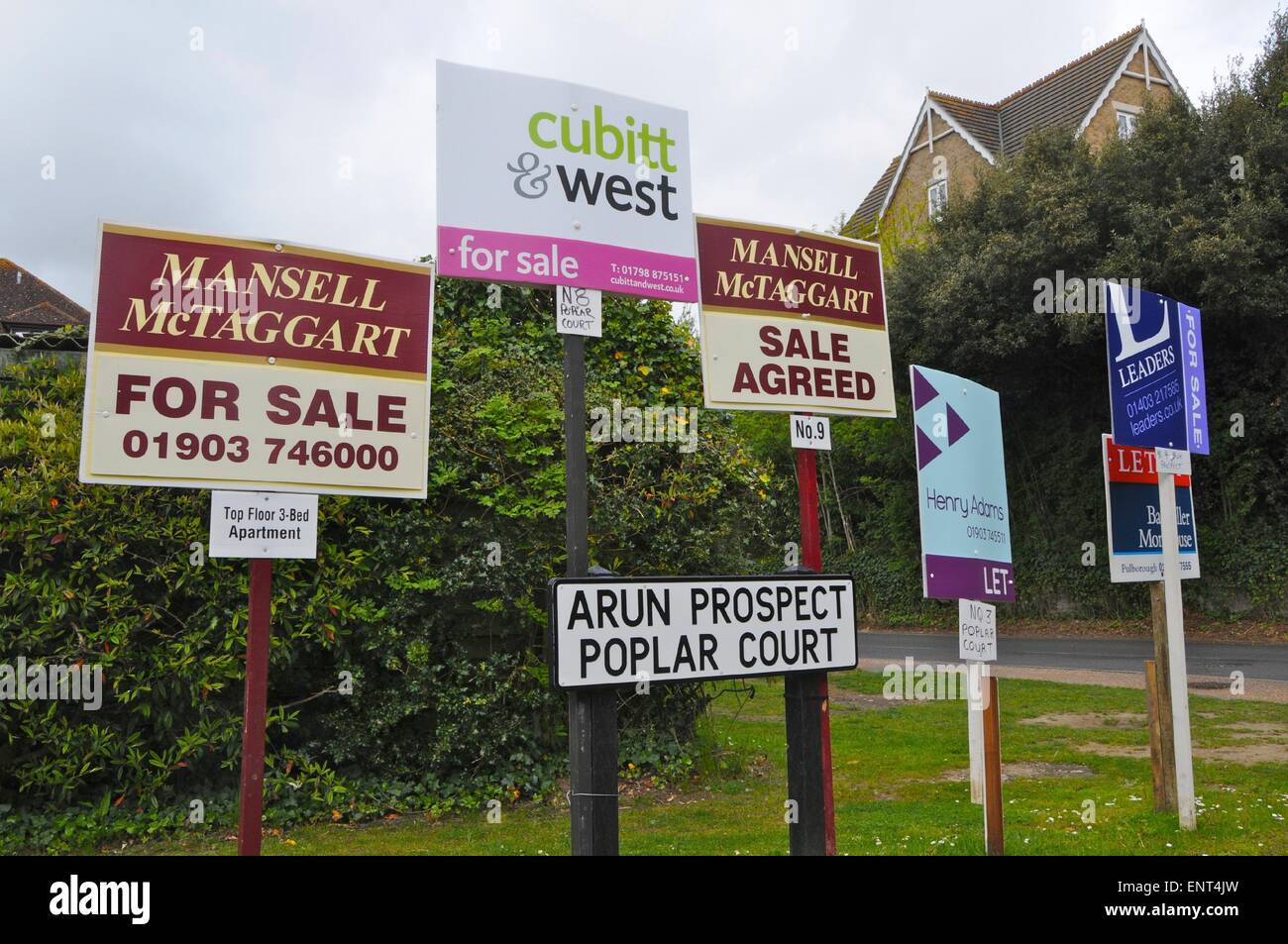 Estate agent agents sale and let boards Stock Photo