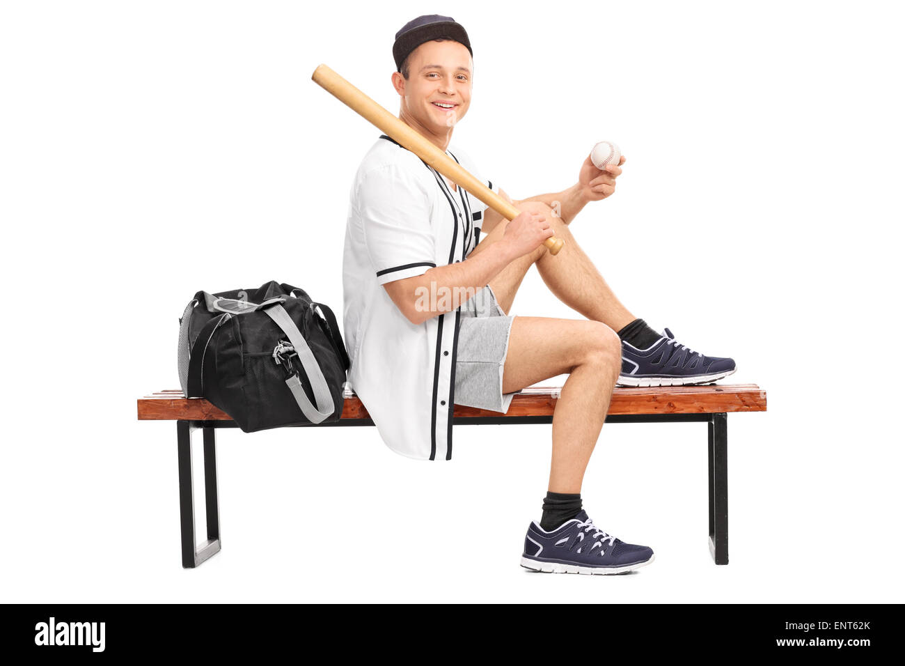 Baseball player posing for the camera Stock Photo - Alamy