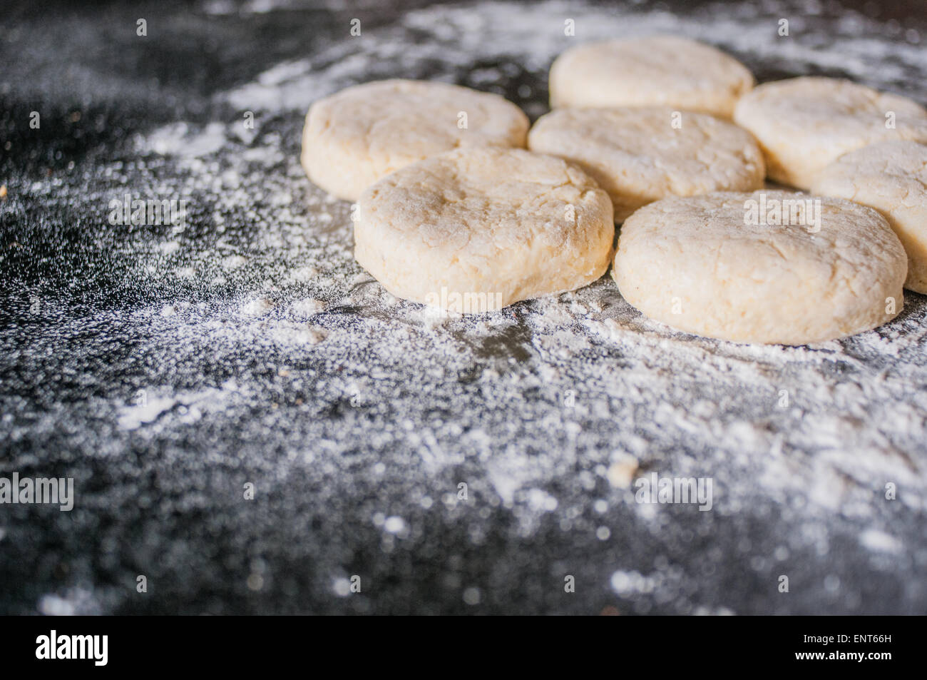 Americanstyle Southern biscuit dough on a floured, wooden surface