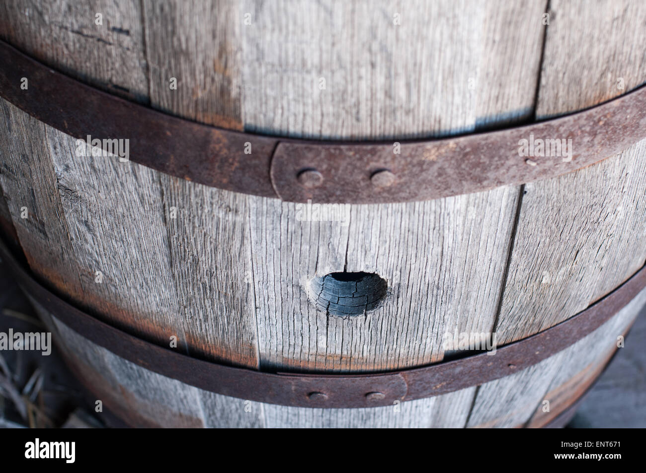 An old, wooden barrel with rusted hoops Stock Photo