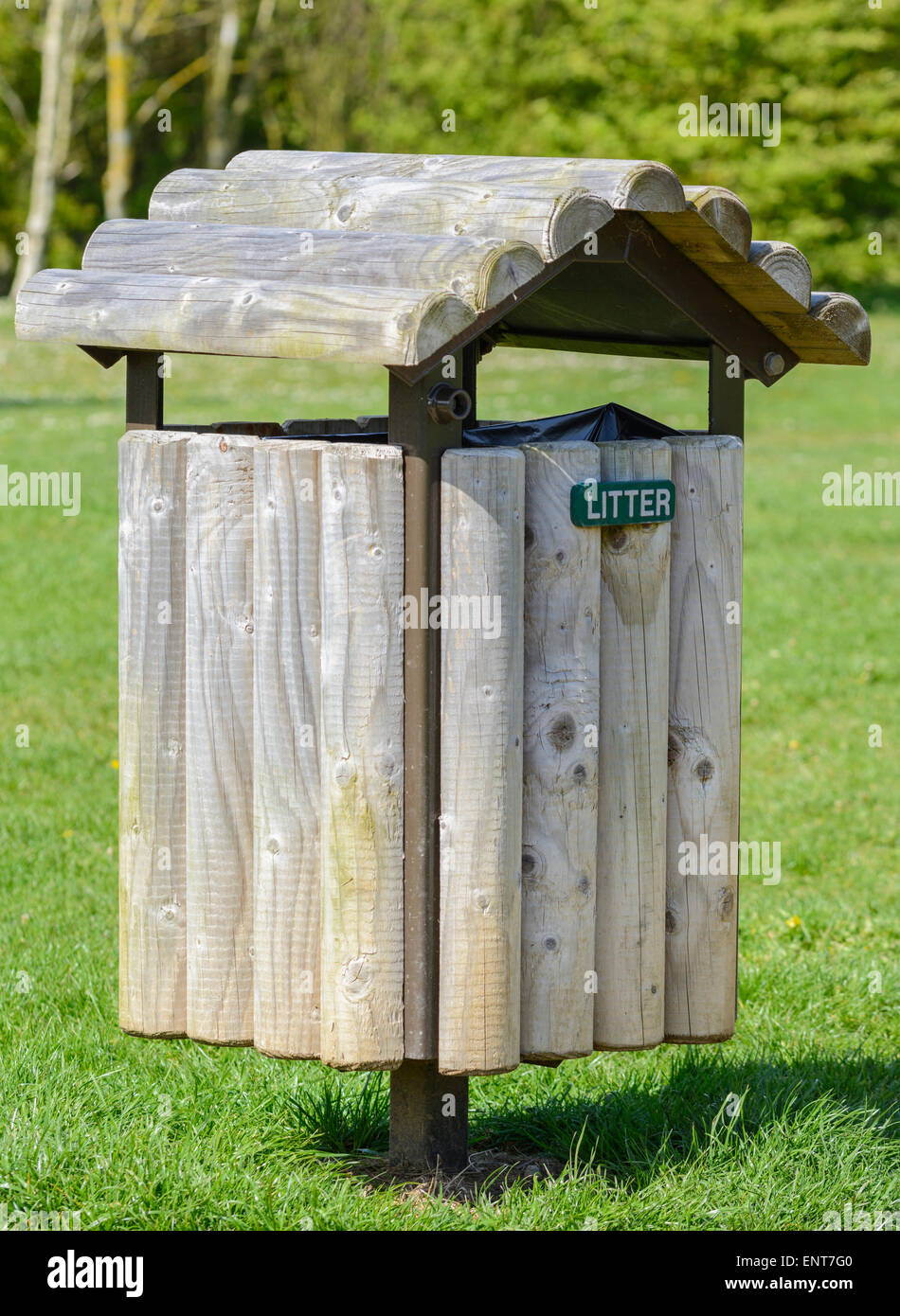 Wooden litter bin in a park. Stock Photo