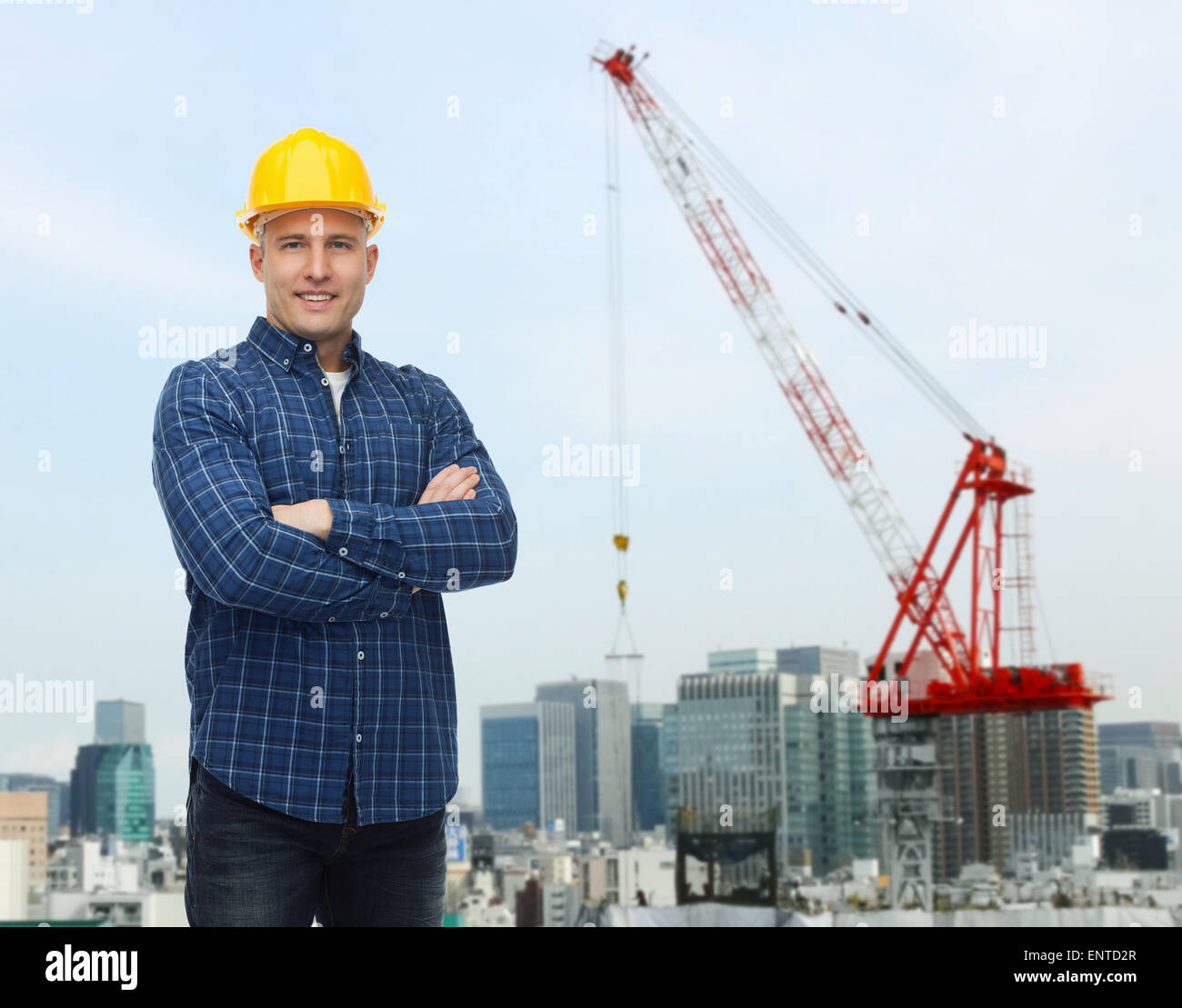 smiling male builder or manual worker in helmet Stock Photo - Alamy