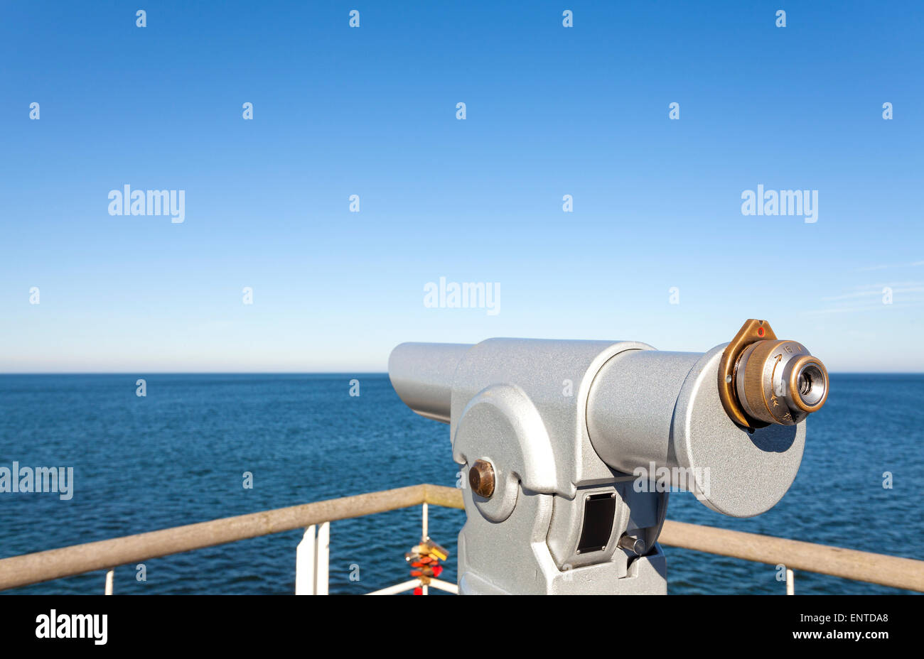 Telescope on a pier pointed at horizon, future concept. Stock Photo