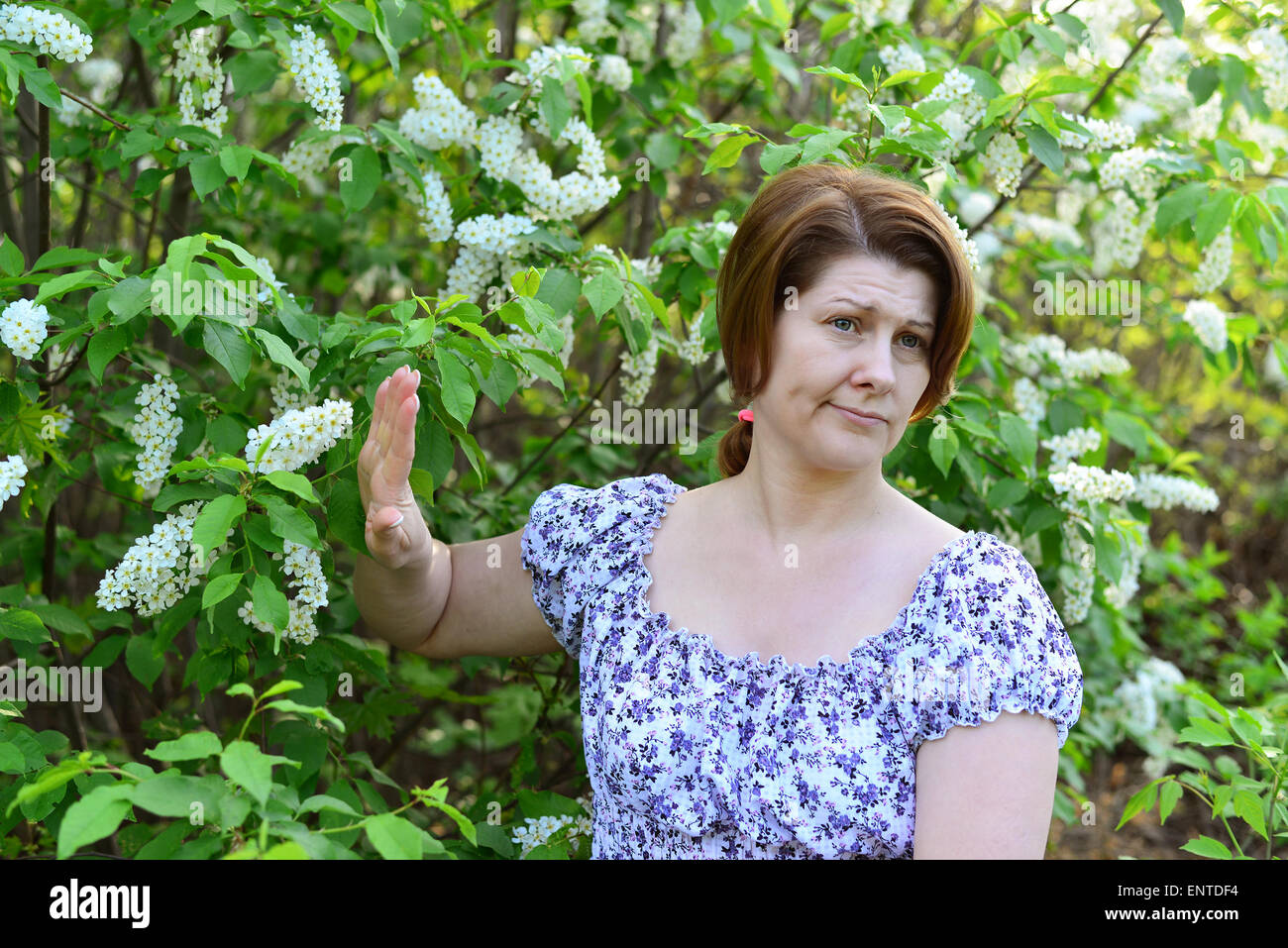 adult woman with allergic diseases removed from a wild cherry blossoms