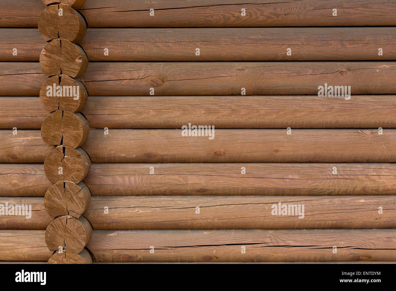 timbered wooden wall made from logs as background Stock Photo