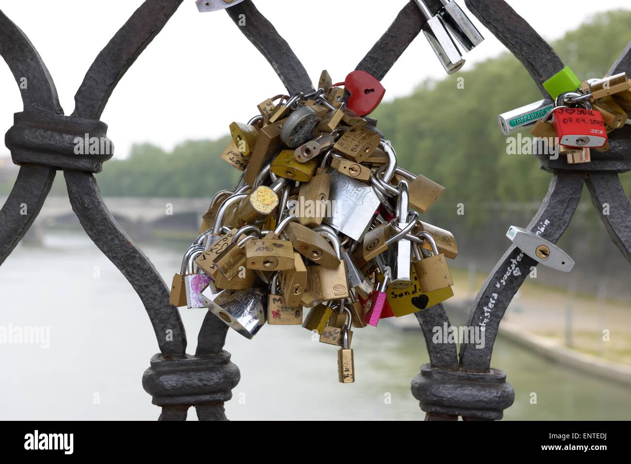 Padlocks on a bridge in Rome symbolising love Stock Photo