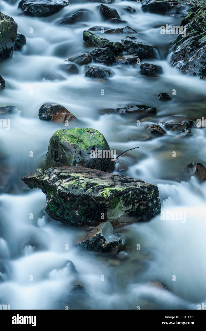 Water flowing down Polmaddy Burn, Dumfries and Galloway, UK Stock Photo