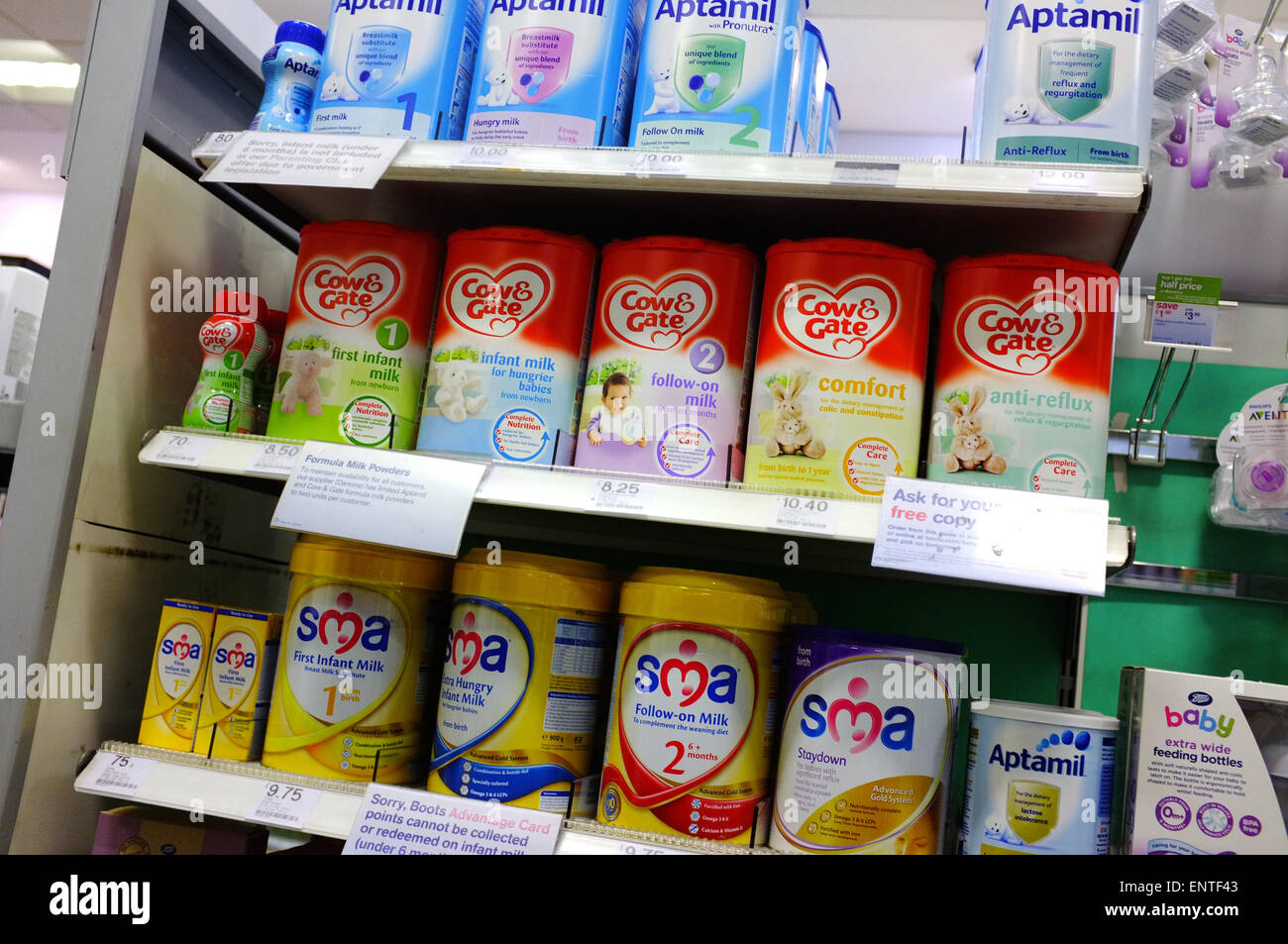 Baby products including feeding formula on a shop shelf in Bristol. Stock Photo