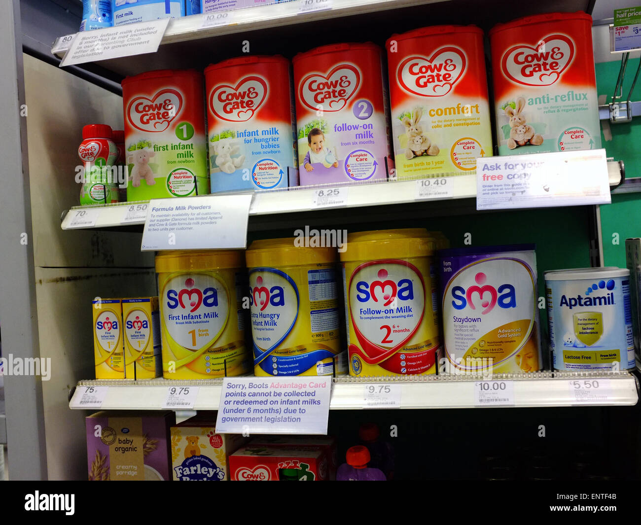 Baby products including feeding formula on a shop shelf in Bristol. Stock Photo