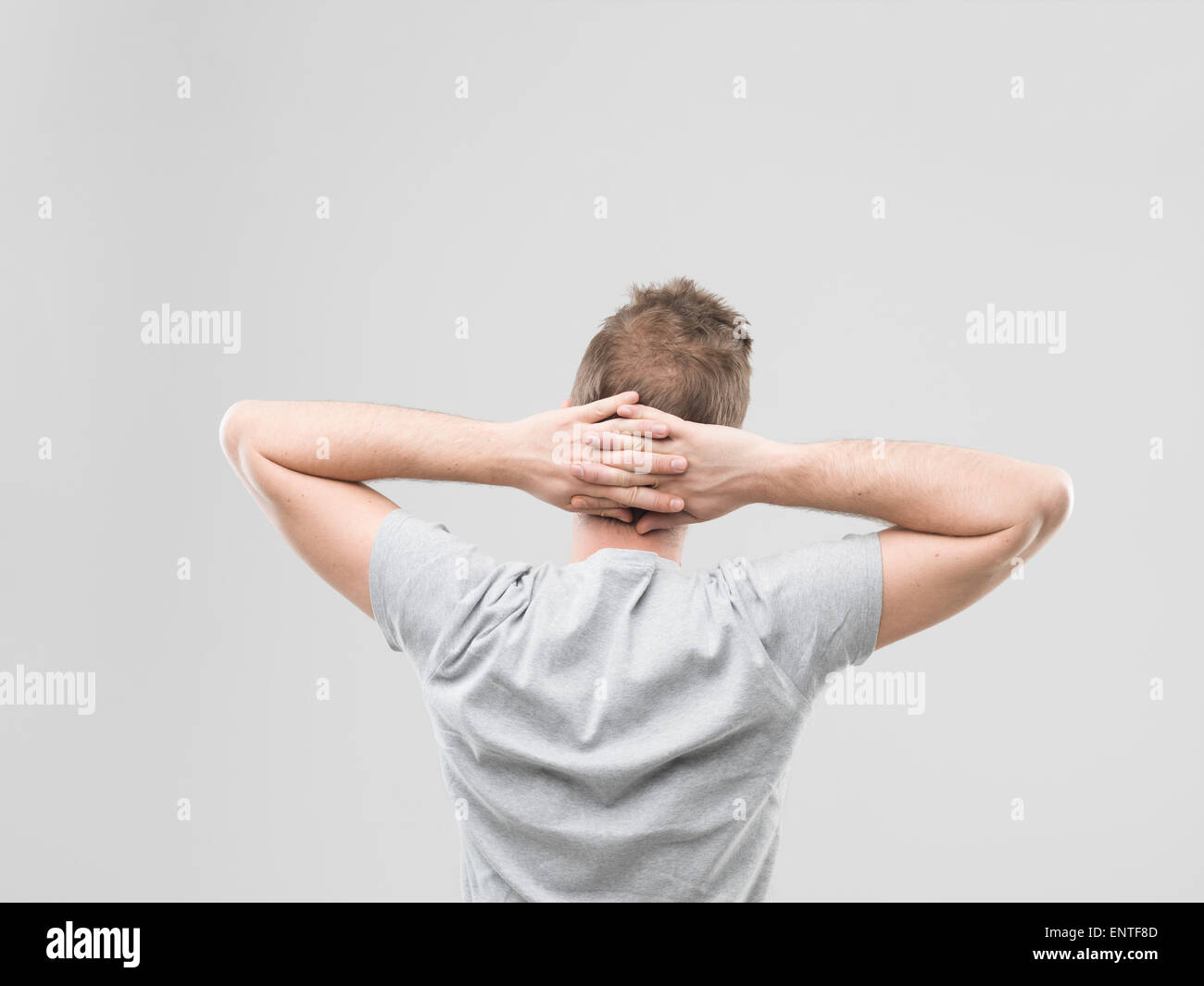 Hands clasped behind back hires stock photography and images Alamy