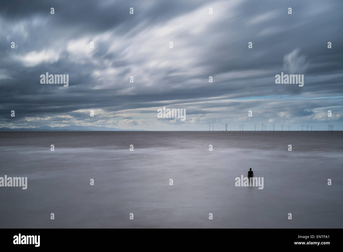 Antony Gormley sculpture on Crosby beach, Merseyside, England, UK - part of the Another Place installation Stock Photo