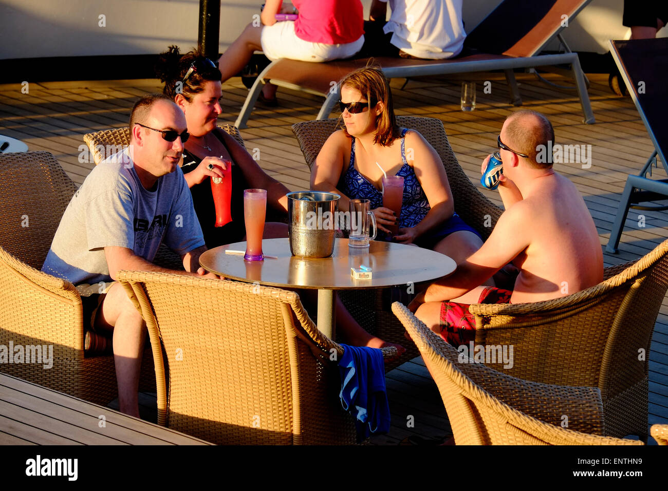 Senior couples relax on the deck of a cruise ship Stock Photo