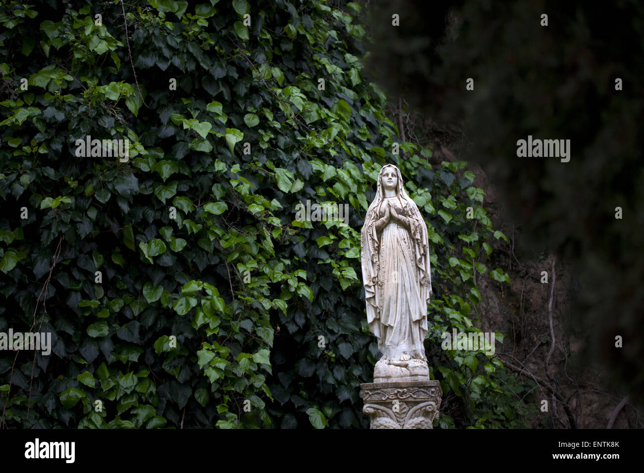 A sculpture of the Virgin Mary decorates a garde in Zahara de la Sierra, Sierra de Grazalema Natural Park, Cadiz province, Andalusia, Spain Stock Photo