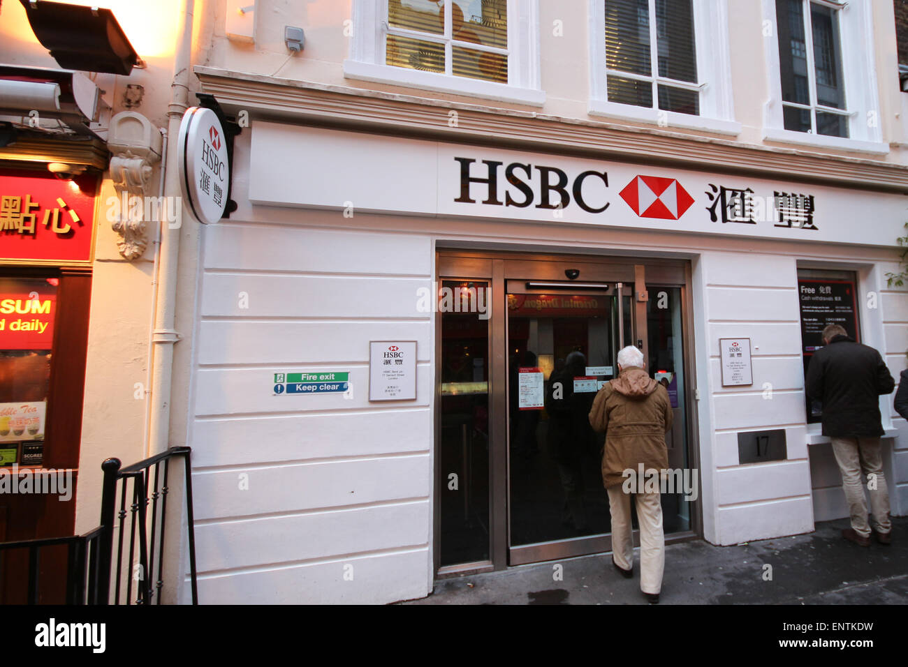 Customers queing at an HSBC bank branch in Chinatown Central London